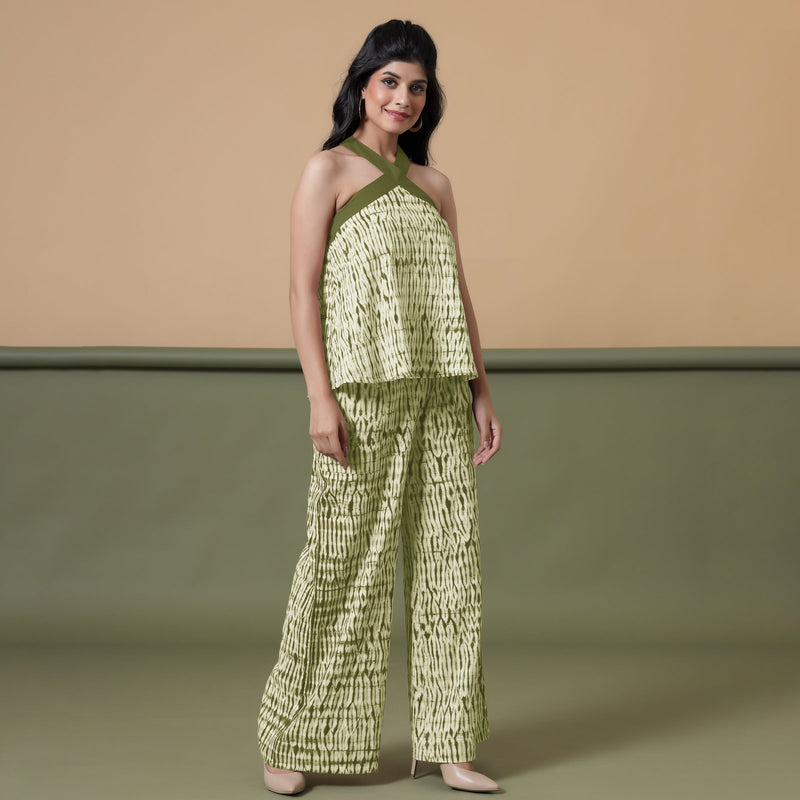 Right View of a Model wearing Olive Green Flared Top and Shibori Pant Set