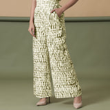 Left View of a Model wearing Olive Green Shibori Wide Legged Pant