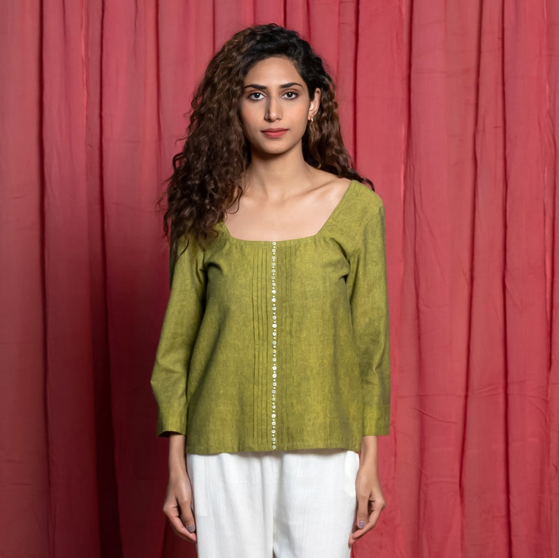 Front View of a Model wearing Olive Green Handspun Cotton Beaded Top