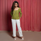 Front View of a Model wearing Olive Green Handspun Cotton Beaded Top