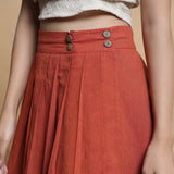 Front Detail of a Model wearing Orange and Brown Reversible Pleated Flared Skirt