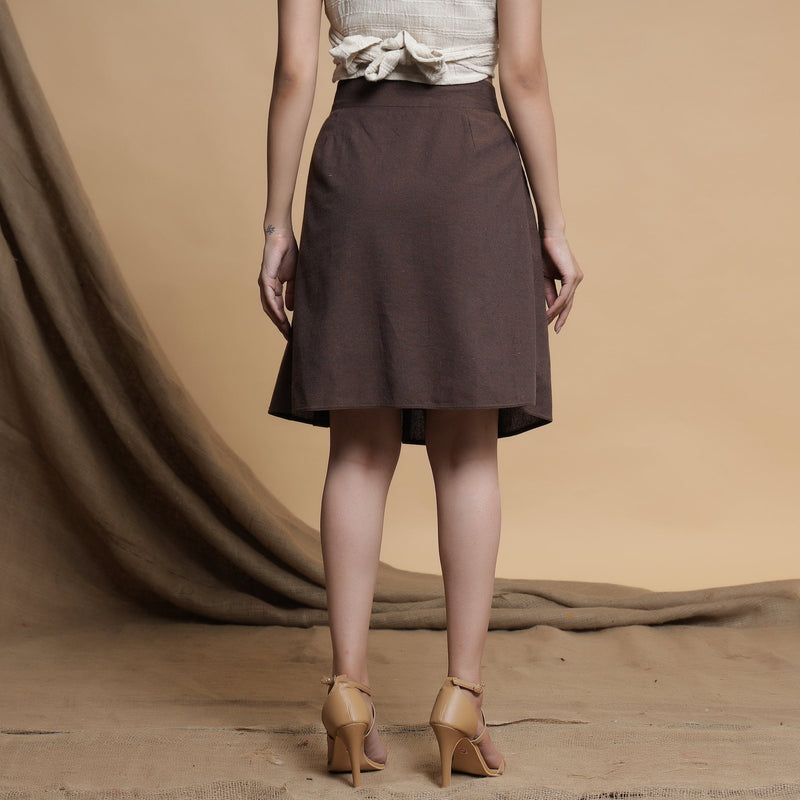 Back View of a Model wearing Orange and Brown Reversible Pleated Flared Skirt