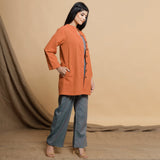 Right View of a Model wearing Orange Button Down High Neck Outerwear