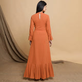 Back View of a Model wearing Orange Floor Length Pleated Tier Dress