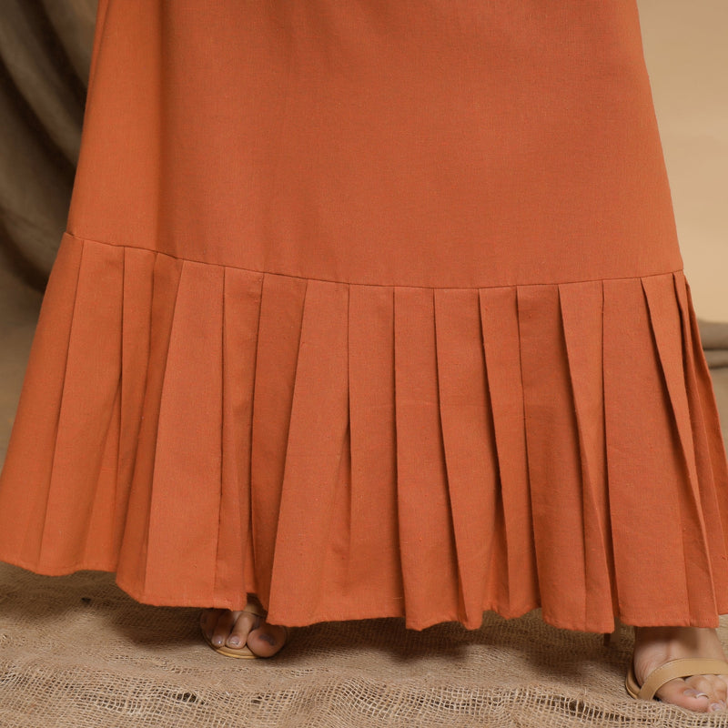 Close View of a Model wearing Orange Floor Length Pleated Tier Dress