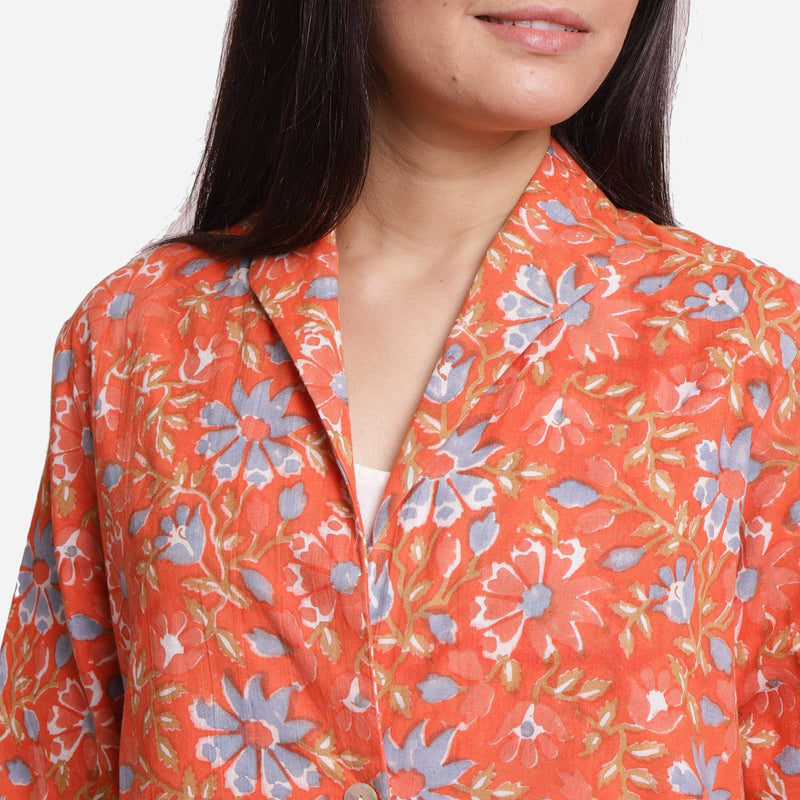 Front Detail of a Model wearing Orange Floral Knee Length Trench Coat