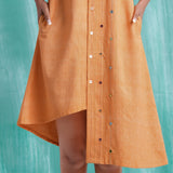 Close View of a Model wearing Orange Mirrored Asymmetrical Shirt Dress