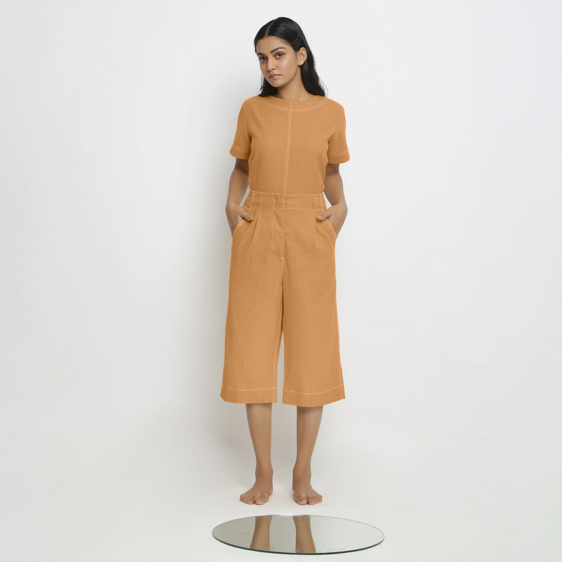 Front View of a Model wearing Orange Paneled Top and Mid-Rise Culottes Set