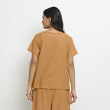 Back View of a Model wearing Vegetable-Dyed Orange 100% Cotton Paneled Top