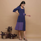 Right View of a Model wearing Paneled Ikat Blue Handspun Slit Dress