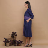 Left View of a Model wearing Paneled Ikat Blue Handspun Slit Dress