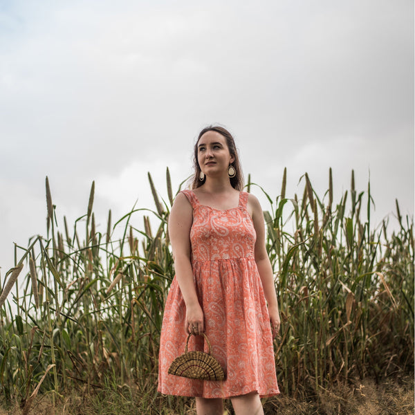 Front View of a Model wearing Peach Paisley Fit and Flare Cotton Dress