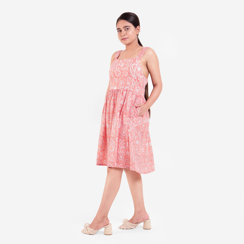 Left View of a Model wearing Peach Paisley Fit-and-Flare Cotton Dress