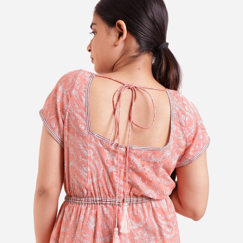 Back Detail of a Model wearing Peach Square Neck High Rise Jumpsuit