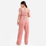 Back View of a Model wearing Peach Square Neck High Rise Jumpsuit
