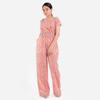 Front View of a Model wearing Peach Square Neck High Rise Jumpsuit