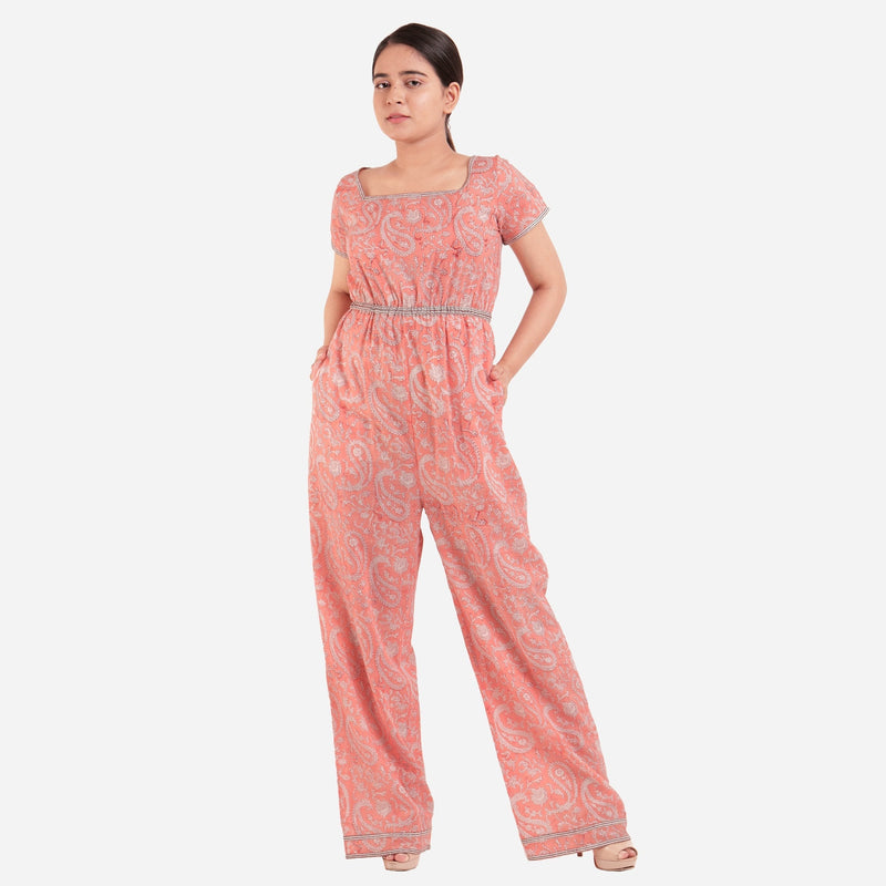 Front View of a Model wearing Peach Square Neck High Rise Jumpsuit