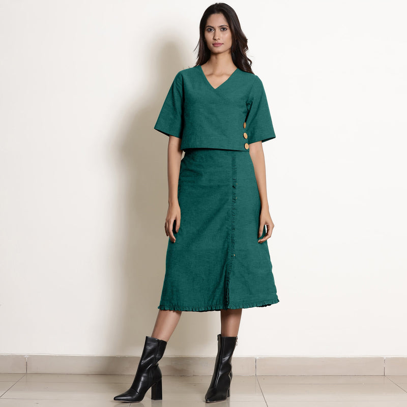 Front View of a Model wearing Pine Green Wrap Top and A-Line Skirt Set