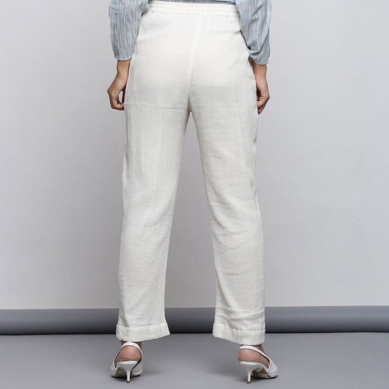 Back View of a Model Wearing Off-White Crinkled Cotton Tapered Pant