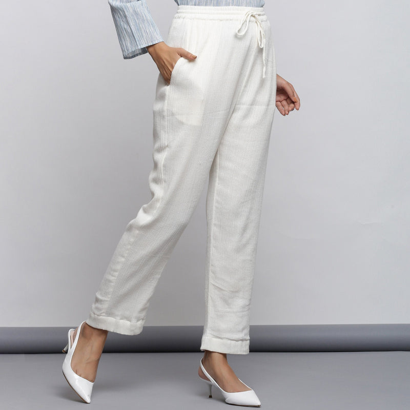 Right View of a Model wearing Off-White Crinkled Cotton Tapered Pant