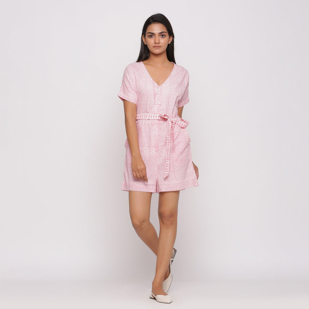 Front View of a Model wearing Pink Button-Down Short V-Neck Romper