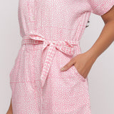 Front Detail of a Model wearing Pink Button-Down Short V-Neck Romper