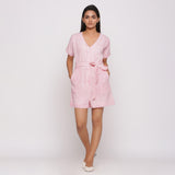 Front View of a Model wearing Pink Button-Down Short V-Neck Romper