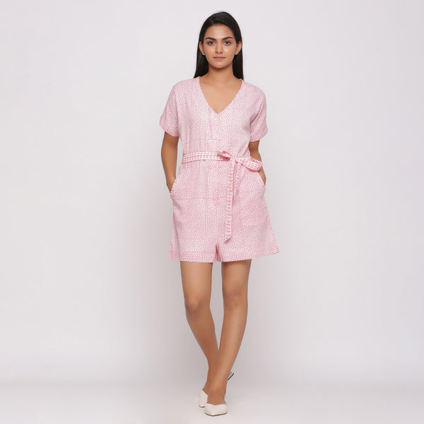 Front View of a Model wearing Pink Button-Down Short V-Neck Romper