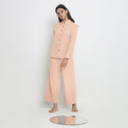 Front View of a Model wearing Pink Button-Down Top and Powder Pink Pant Set