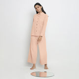 Front View of a Model wearing Pink Button-Down Top and Powder Pink Pant Set