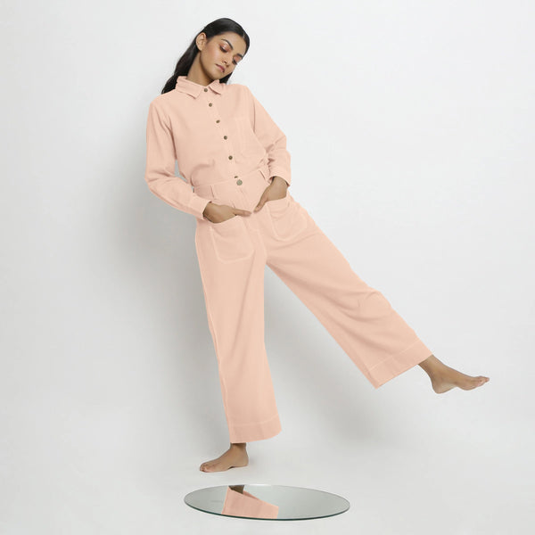 Front View of a Model wearing Pink Button-Down Top and Powder Pink Pant Set