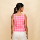 Back View of a Model wearing Pink Checks Cotton Muslin Sleeveless Short Top
