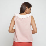 Back View of a Model wearing Pink Frilled Cotton Chambray Straight Top