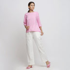 Front View of a Model wearing Pink Hand Tie Dyed Cotton Flared Top