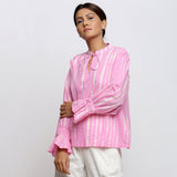 Left View of a Model wearing Pink Hand Tie Dyed Shirred Blouson Top