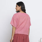 Back View of a Model wearing Pink Handspun Yoked Anti-Fit Top