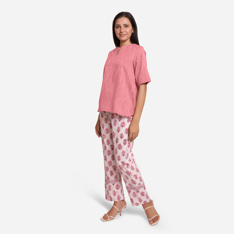 Left View of a Model wearing Pink High-Low Top and Block Print Pant Set
