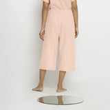 Back View of a Model wearing Vegetable Dyed Pink 100% Cotton Mid-Rise Culottes