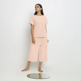 Front View of a Model wearing Pink Paneled Top and Mid-Rise Culottes Set