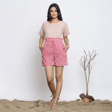 Front View of a Model wearing Pink Striped Handspun Paperbag Shorts