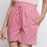Front Detail of a Model wearing Pink Striped Handspun Paperbag Shorts