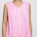 Front Detail of a Model wearing Pink Tie and Dye Tiered V-Neck Dress