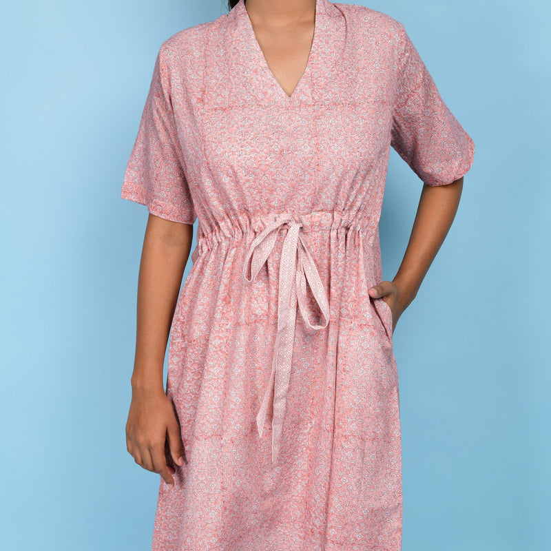 Front Detail of a Model wearing Powder Pink Block Print 100% Cotton Knee-Length Kaftan Dress