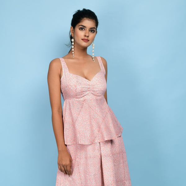 Front View of a Model wearing Powder Pink Block Printed 100% Cotton Peplum Top