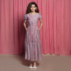 Front View of a Model wearing Powder Pink Chanderi Block Print Tier Peasant Dress