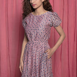 Front Detail of a Model wearing Powder Pink Chanderi Block Print Tier Peasant Dress