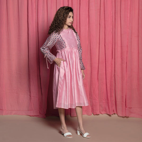Right View of a Model wearing Powder Pink Chanderi Frilled Peasant Dress