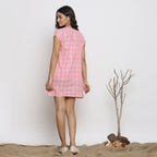 Back View of a Model wearing Powder Pink Handspun Yoked Dress