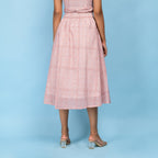 Back View of a Model wearing Powder Pink Block Printed 100% Cotton A-Line Skirt