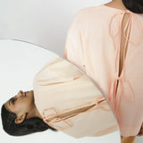 Back Detail of a Model wearing Powder Pink Vegetable Dyed Straight Fit Top